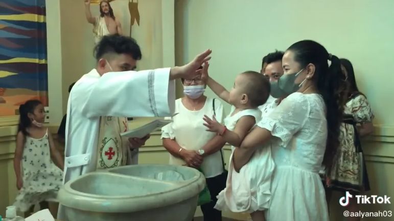 adorable kid gives priest a high five